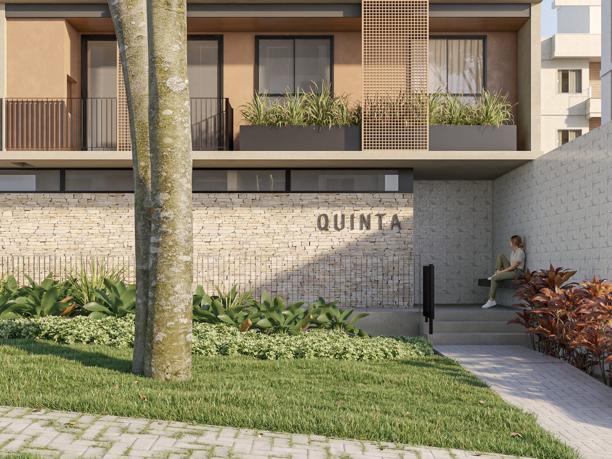 Fachada do Residencial Quinta: entrada em muro de pedra com o letreiro Quinta, jardim e árvore em primeiro plano